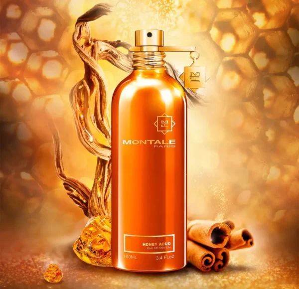 Miedziany flakon perfum Montale Honey Aoud, otoczony przez plaster miodu, kawałki cynamonu i drewno, na błyszczącym, złotym tle.